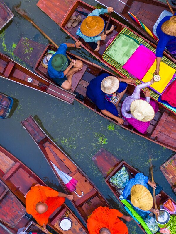 Visit the vibrant markets in and around Bangkok.